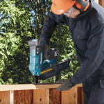 A teal and black Makita cordless framing nailer with 18V a 30–34° magazine, for driving collated nails into structural timber.
