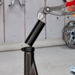 A pair of water-pump pliers with tongue-and-groove adjustable jaws for gripping pipes, nuts, and irregular shapes.