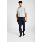A white polo shirt designed for use on construction sites and in industrial work environments.,