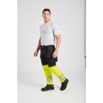 A pair of black work trousers designed for use on construction sites and in industrial work environments.,