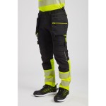 A pair of high-visibility yellow trousers featuring retroreflective tape panels, functional pockets, suitable for a wide range of outdoor and site work applications.