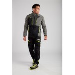 A pair of black work trousers designed for use on construction sites and in industrial work environments.,