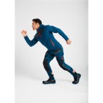 A pair of blue work trousers designed for use on construction sites and in industrial work environments.,