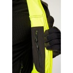 A black softshell jacket designed for use on construction sites and in industrial work environments.,
