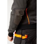 A grey softshell jacket designed for use on construction sites and in industrial work environments.,