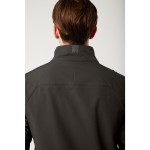 A black jacket featuring stretch panels for ease of movement, suitable for a wide range of outdoor and site work applications.