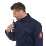 A navy blue coverall featuring flame-resistant fabric, suitable for a wide range of outdoor and site work applications.