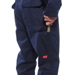 A navy blue coverall featuring flame-resistant fabric, suitable for a wide range of outdoor and site work applications.