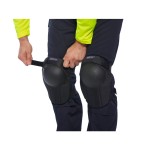 A pair of black foam-padded knee pads with adjustable straps, designed to protect the knees during kneeling work.