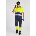 A pair of high-visibility yellow trousers featuring retroreflective tape panels, suitable for a wide range of outdoor and site work applications.