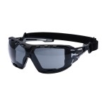 A pair of safety spectacles with clear impact-resistant lenses and adjustable side arms, for eye protection during site work.