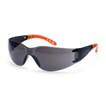 A pair of safety spectacles with clear impact-resistant lenses and adjustable side arms, for eye protection during site work.