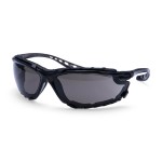 A pair of safety spectacles with clear impact-resistant lenses and adjustable side arms, for eye protection during site work.