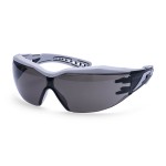 A pair of safety spectacles with clear impact-resistant lenses and adjustable side arms, for eye protection during site work.