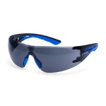 A pair of safety spectacles with clear impact-resistant lenses and adjustable side arms, for eye protection during site work.