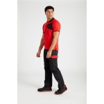 A red polo shirt designed for use on construction sites and in industrial work environments.,