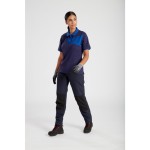 A women's navy blue polo shirt designed for use on construction sites and in industrial work environments.,