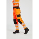 A pair of women's high-visibility orange trousers featuring retroreflective tape panels, stretch panels for ease of movement, suitable for a wide range of outdoor and site work applications.