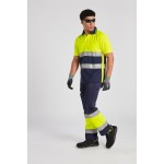 A high-visibility yellow polo shirt featuring retroreflective tape panels, suitable for a wide range of outdoor and site work applications.
