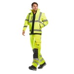 A high-visibility yellow softshell jacket featuring retroreflective tape panels, suitable for a wide range of outdoor and site work applications.