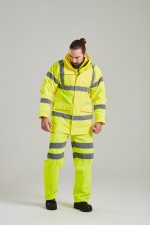 A high-visibility yellow waterproof jacket featuring retroreflective tape panels, suitable for a wide range of outdoor and site work applications.