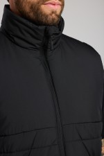 A black safety vest featuring a warm thermal lining, suitable for a wide range of outdoor and site work applications.