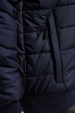 A navy blue padded jacket featuring a warm thermal lining, suitable for a wide range of outdoor and site work applications.