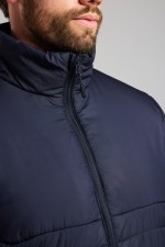 A navy blue padded jacket featuring a warm thermal lining, suitable for a wide range of outdoor and site work applications.