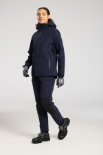 A women's navy blue waterproof jacket designed for use on construction sites and in industrial work environments.,