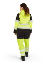 A women's high-visibility yellow jacket featuring retroreflective tape panels, suitable for a wide range of outdoor and site work applications.