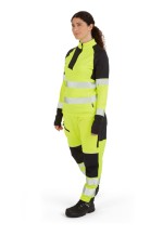 A women's high-visibility yellow work shirt featuring retroreflective tape panels, a full-length zip front, suitable for a wide range of outdoor and site work applications.