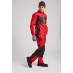 A pair of red work trousers designed for use on construction sites and in industrial work environments.,
