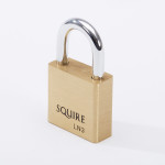 A brass Squire padlock with a silver shackle, standing upright on a white background. The model number LN3 is engraved below the brand name on the lock body.