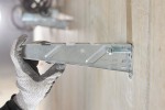 A bright zinc plated through bolt anchor with a hex nut and washer, featuring a threaded shaft and expansion sleeve, designed for securing heavy loads to concrete or masonry surfaces.