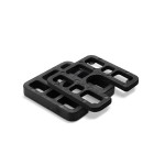 Two black rectangular plastic shims with slots and cutouts, stacked slightly askew on a white background.