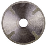 A circular metal object with a hole in the middle.,
