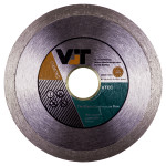 A circular diamond blade with a metal rim and a central hole. The label displays the brand VIT, specifications, and usage information, with sections in black, orange, green, and white colors.