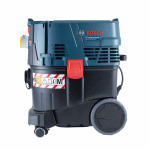 A Bosch Professional wet and dry vacuum cleaner with a dark blue and black body, large wheels, a red latch, and warning labels, shown on a white background.