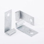 Two metal L-shaped brackets with holes near the ends and curled edges, positioned upright on a white background.