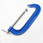 A Faithfull clamp with an adjustable jaw and a screw-tightening mechanism, for holding workpieces in position during cutting, drilling, or bonding.