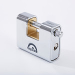 A silver rectangular Squire padlock with a keyhole on the side and a visible brass locking mechanism, photographed on a white background.