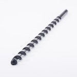A close-up of a long, black, spiral drill bit designed for boring holes, placed on a white background with the tip facing the camera.