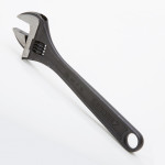 A Gedore adjustable spanner with a smooth-jaw jaw opening controlled by a worm-gear wheel, suitable for a range of nut sizes.