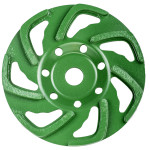 A green circular metal grinding or cutting disc with curved slots and a central hole, designed for use with power tools. The disc has a textured finish and features multiple openings along the edge.