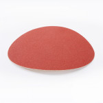 A single round sheet of red sandpaper is shown on a white background.,