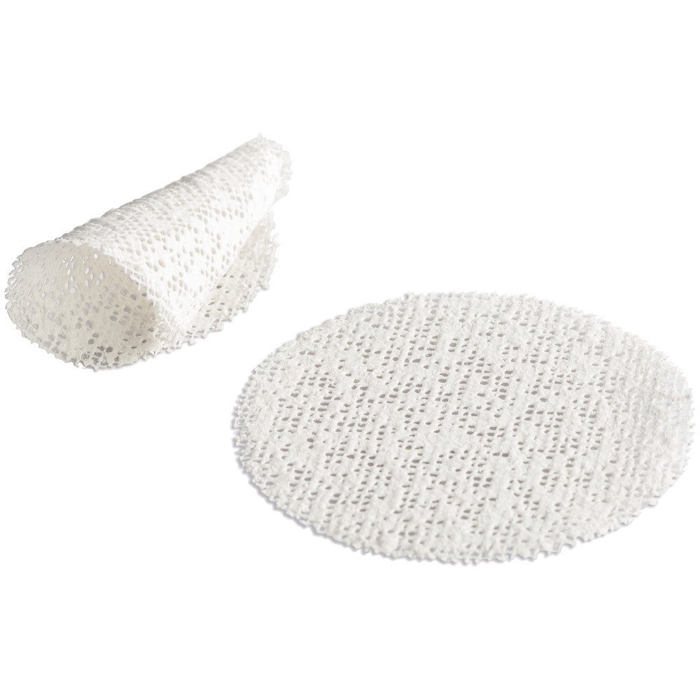 A white, round, perforated sheet is shown flat on a surface, with another similar sheet partially rolled next to it. The sheets have a mesh-like texture with evenly spaced holes.