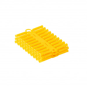 A bundle of yellow plastic hollow wall anchors stacked together and connected by a strip, isolated on a white background.