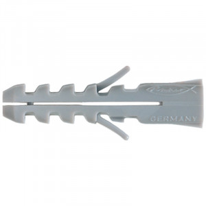 Grey plastic wall plug anchor with ridges and two expansion flanges, used for securing screws in masonry or drywall. The word GERMANY is embossed on the right end.