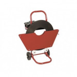 A red wheeled cart with a handle, holding a large spool of strapping material and a small container attached to the top, used for transporting and dispensing packing straps.