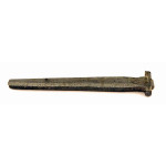 A rusted, antique metal railroad spike with a flat head, shown on a plain white background.